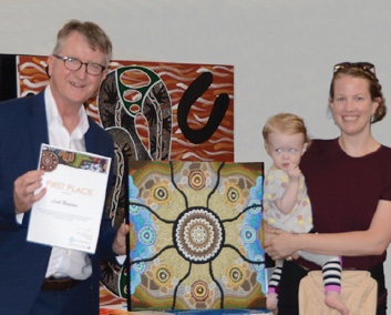 Image ACT Ombudsman Michael Manthorpe PSM with art competition winner Leah Brideson